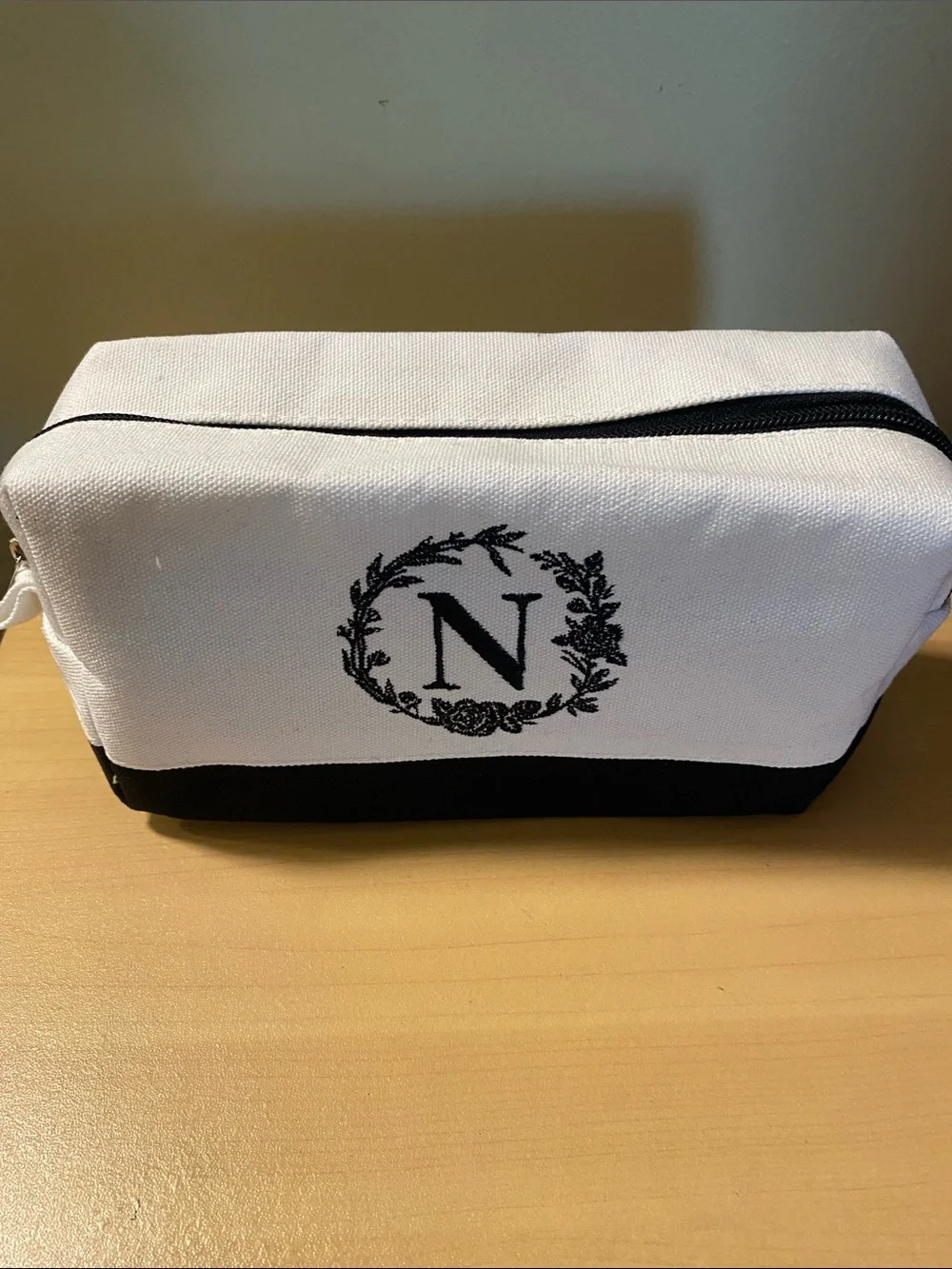 Initial N black and white lined toiletry bag